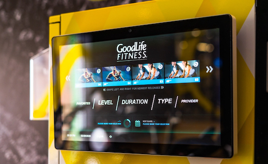 Touchscreen with different types of GoodLife workouts.