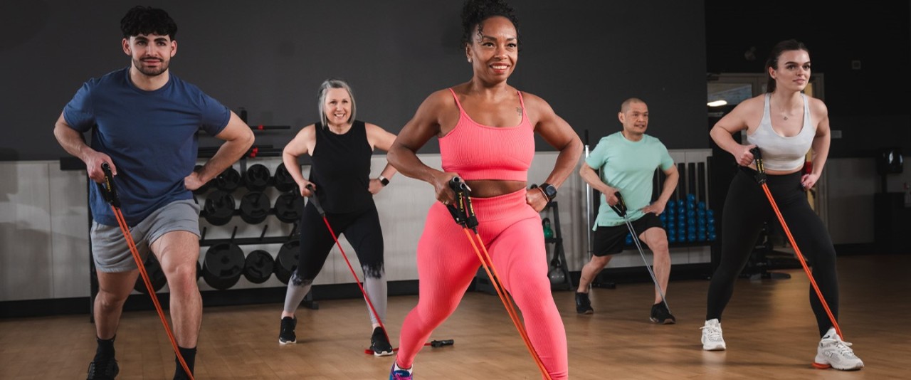 A group of members take part in a class at a GoodLife Fitness studio.
