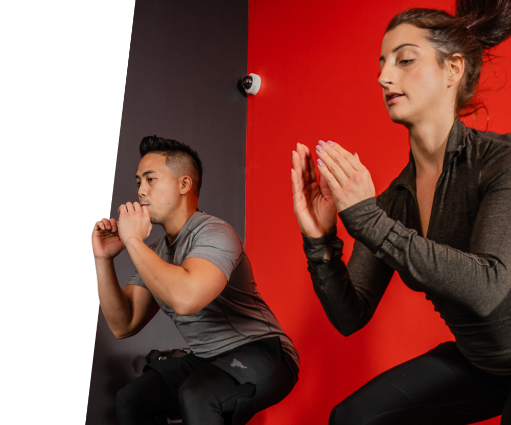 Woman and man doing box jumps