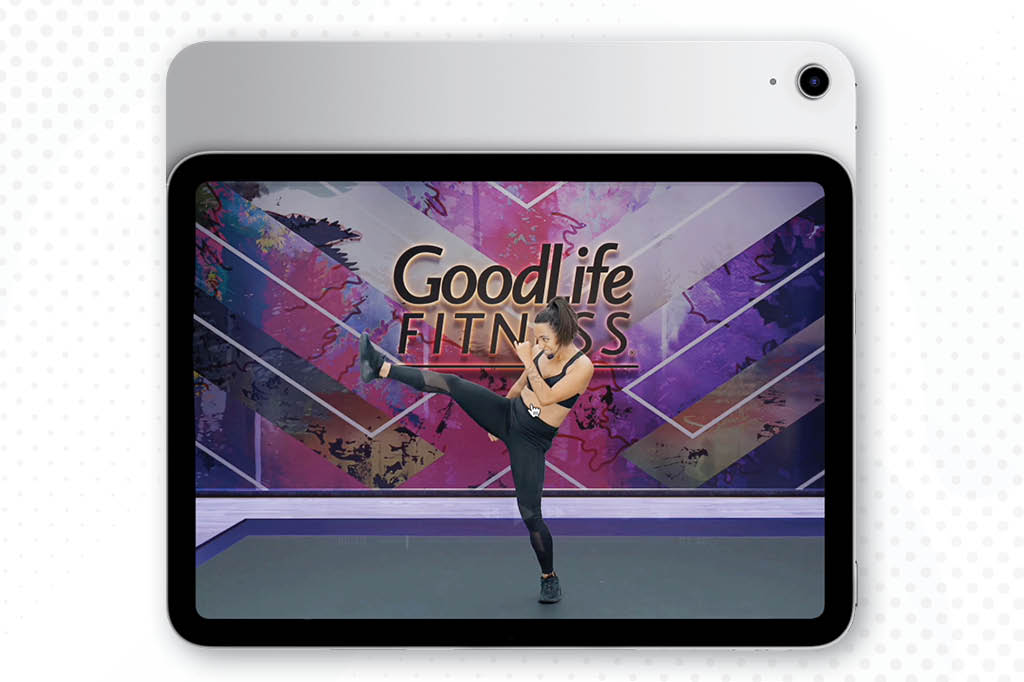 A Member talking with a GoodLife Associate, and another person smiling.