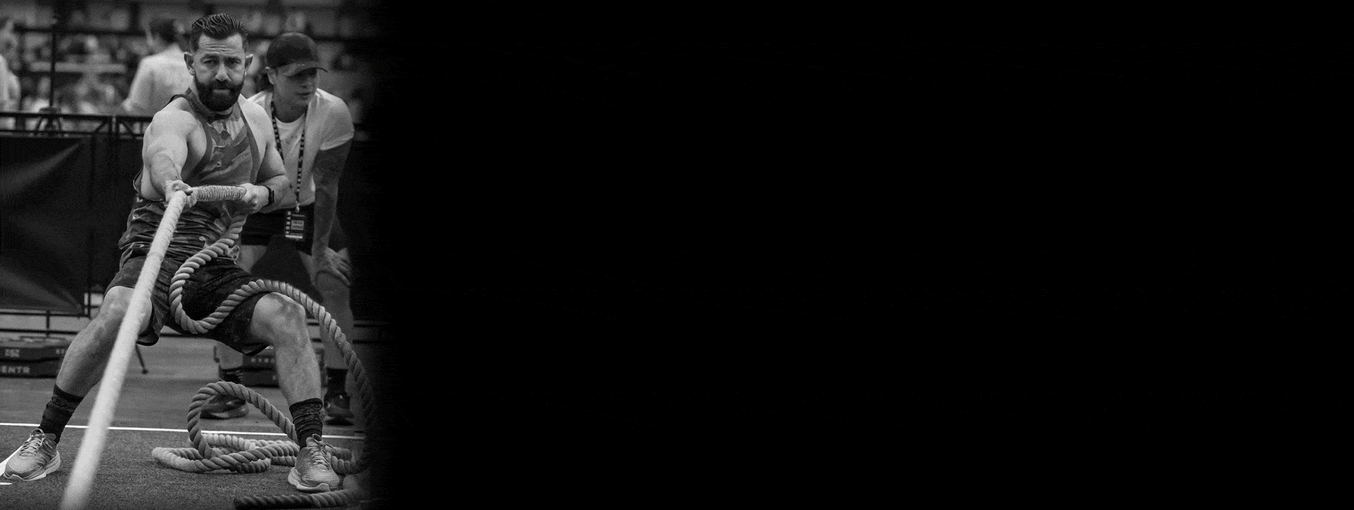 A dynamic image of two HYROX Training Club participants during an activity.